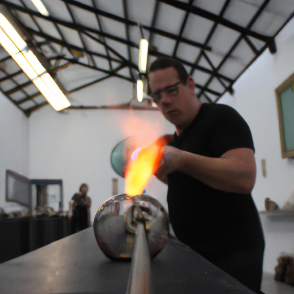 Person blowing glass in gallery