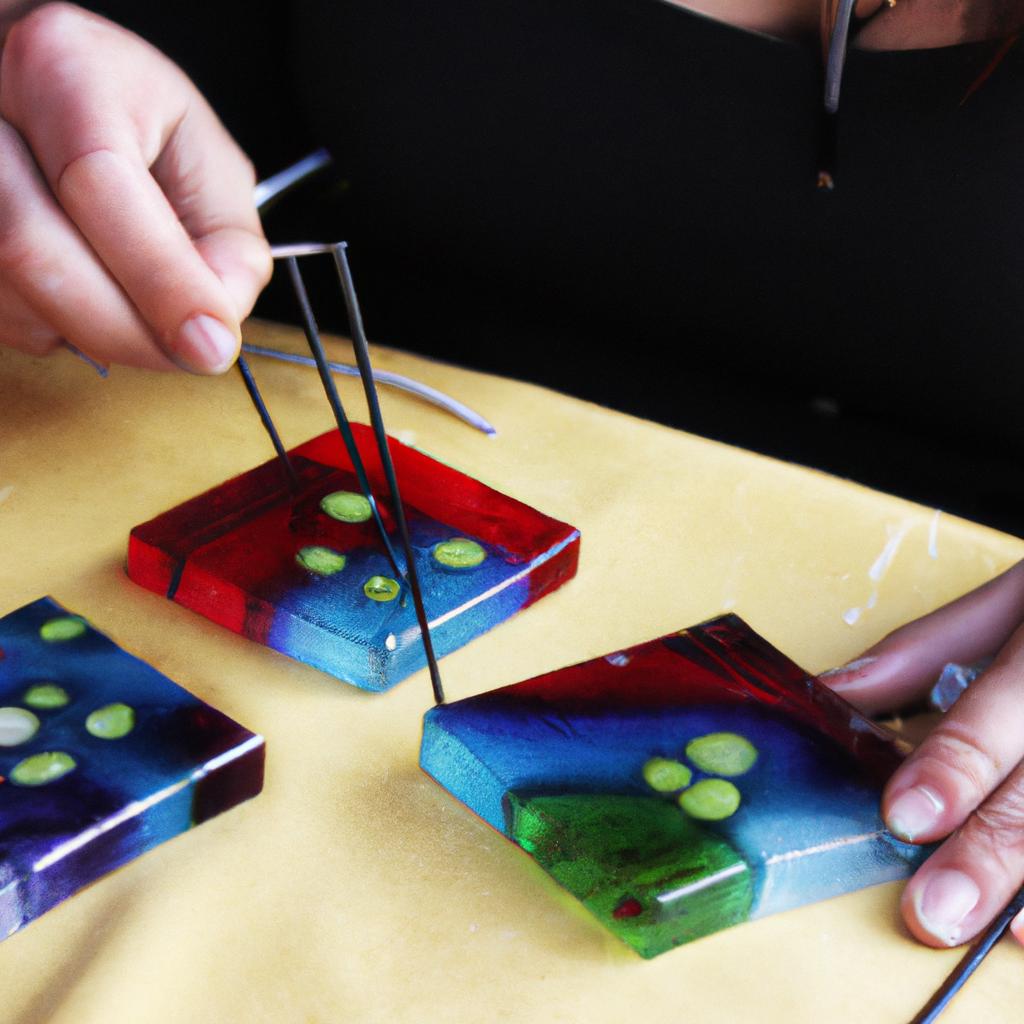 Person creating fused glass artwork