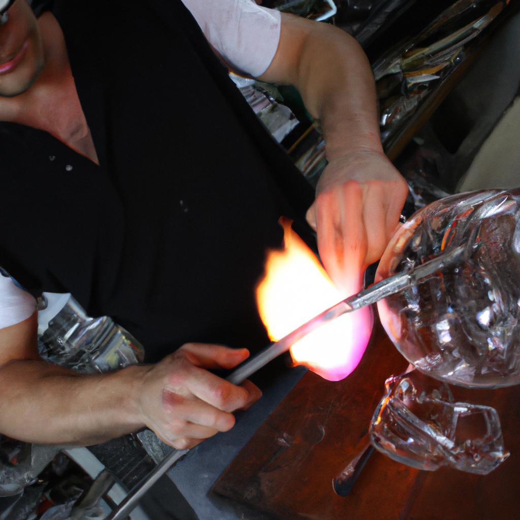 Person creating glass artwork