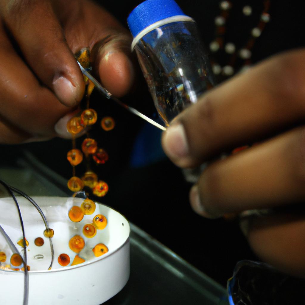 Person making glass beads art