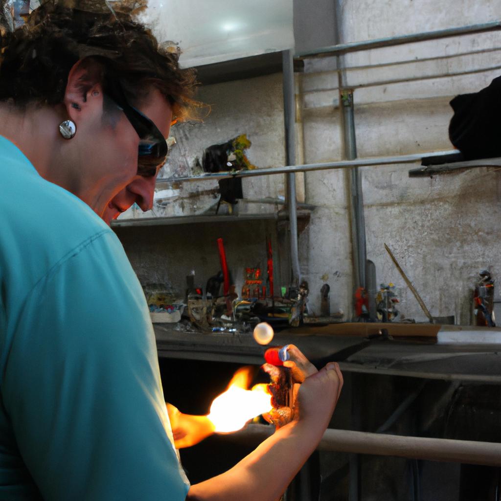 Person lampworking in glass gallery